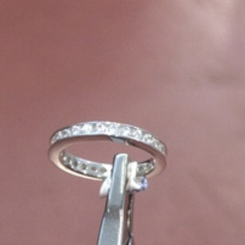Eternity ring in white topaz and silver. Size 6